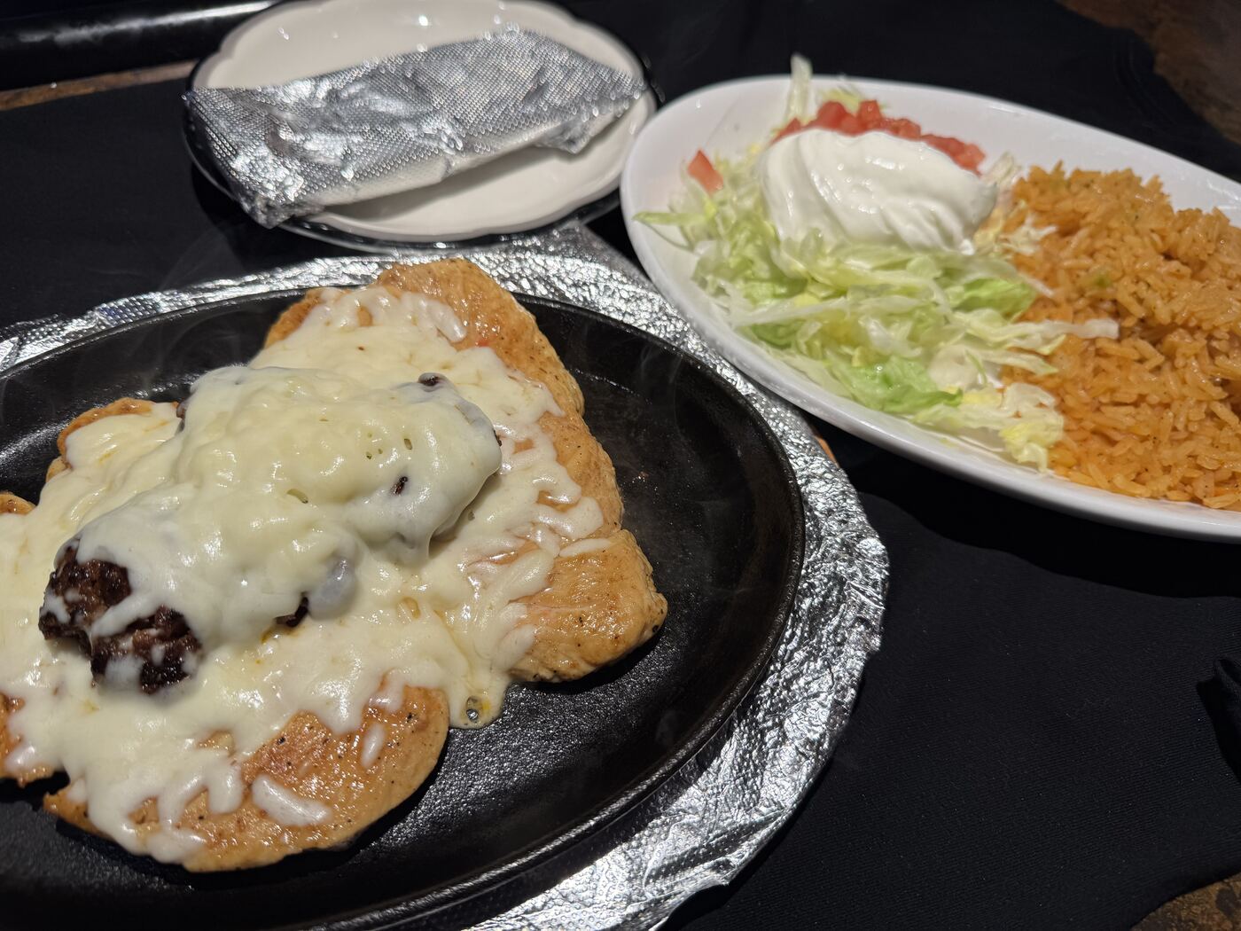 Pollo Loco on a sizzling skillet